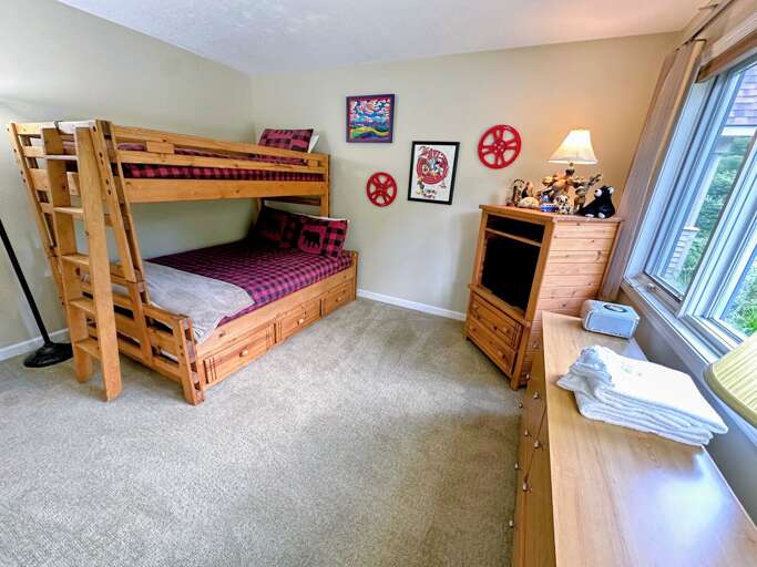 Guest bedroom features a twin-over-full bunk