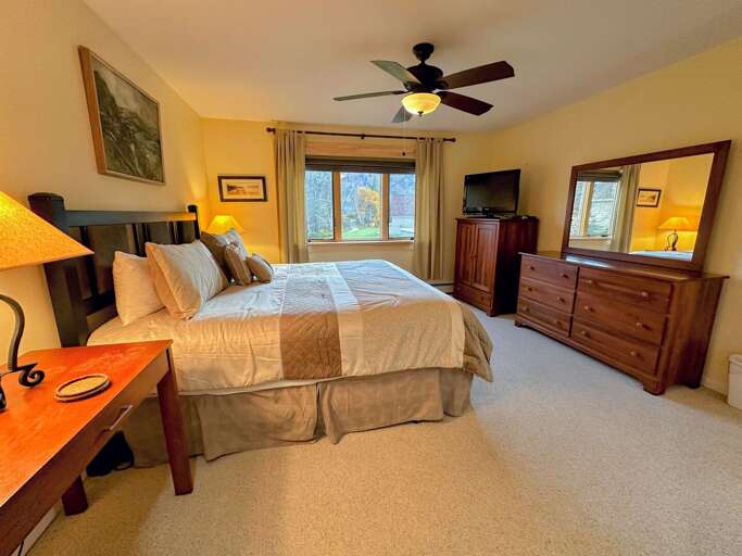 Spacious bedroom and attached bathroom located on the main level.