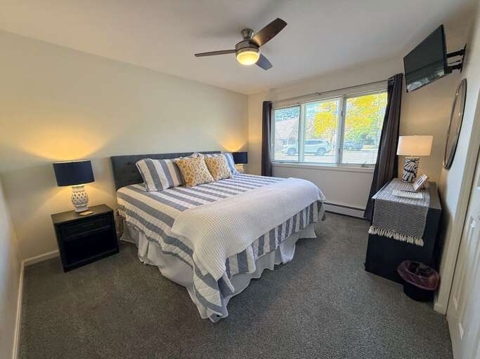 Guest bedroom #1 is located on the main level and features a King bed, TV and ceiling fan. Sleeps 2. Guest bedroom #1 is located on the main level and features a King bed, TV and ceiling fan. Sleeps 2.
