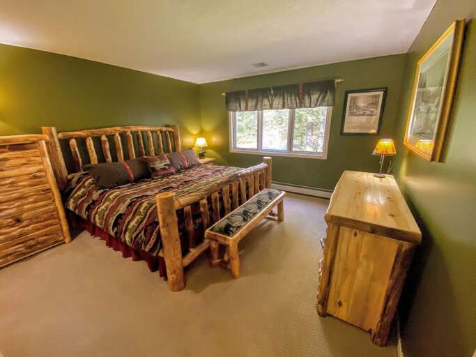 The master bedroom is located on the main level and features a King size bed and attached bathroom. Sleeps 2.