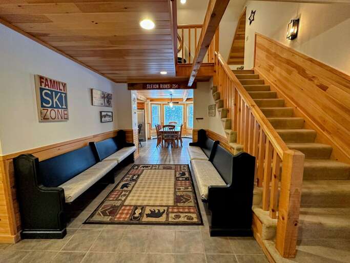 The second level features an open loft area overlooking the living room.