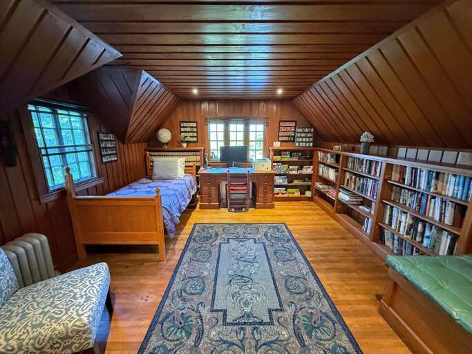 The North Wing library, which features a Twin bed and a workspace with a view