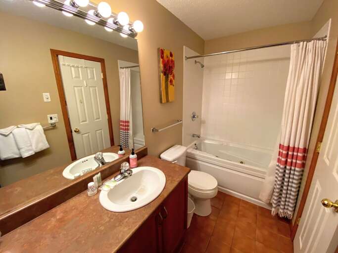 Upstairs King 1 Ensuite Bath with jetted tub 2 Upstairs King 1 Ensuite Bath with jetted tub 2
