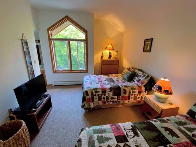 Guest Bedroom #1 is located on the second floor and features 2 Double beds with an attached bathroom. Sleeps 4. Guest Bedroom #1 is located on the second floor and features 2 Double beds with an attached bathroom. Sleeps 4.