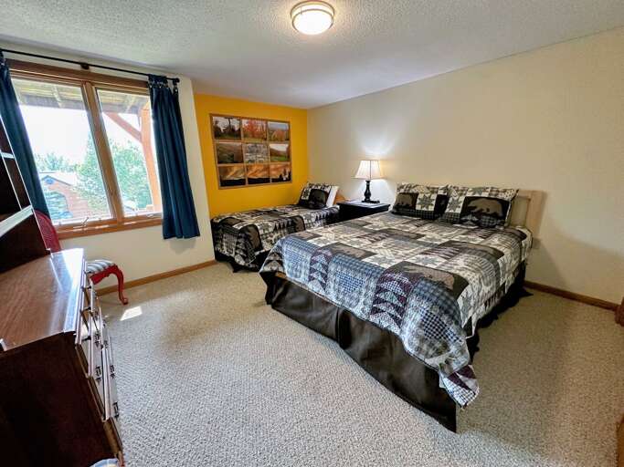 Lower level bedroom with Queen and Twin Beds