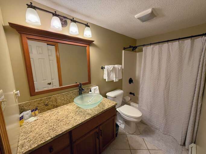 Lower Level bathroom with a shower/tub combo Lower Level bathroom with a shower/tub combo