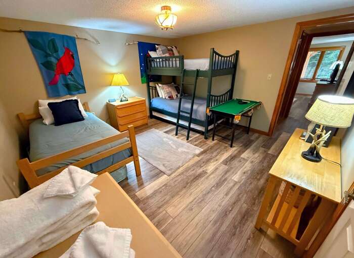 Lower Level bedroom with Twin-over-Twin bunk bed and separate Twin bed