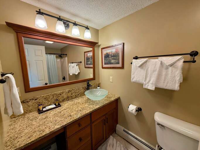 Upper-level bathroom with a shower/tub combo Upper-level bathroom with a shower/tub combo