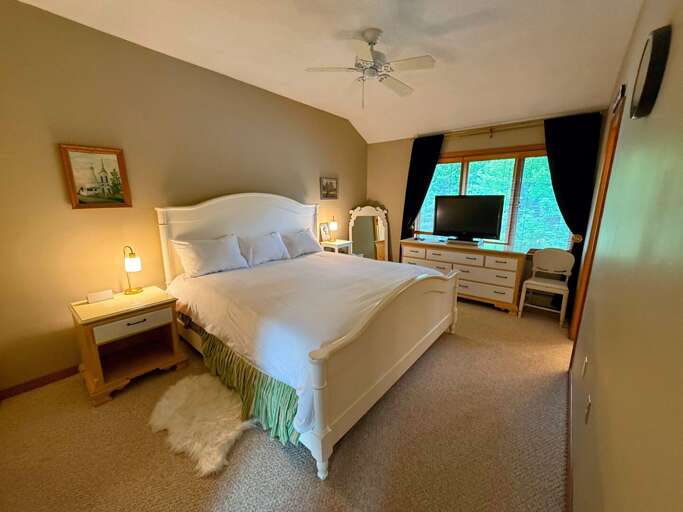 Upper-level Bedroom with a King bed and bathroom with a shower/tub combo Upper-level Bedroom with a King bed and bathroom with a shower/tub combo