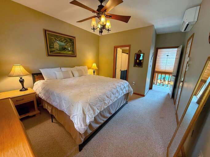 Upper-level Bedroom with a King bed and bathroom with a shower/tub combo Upper-level Bedroom with a King bed and bathroom with a shower/tub combo