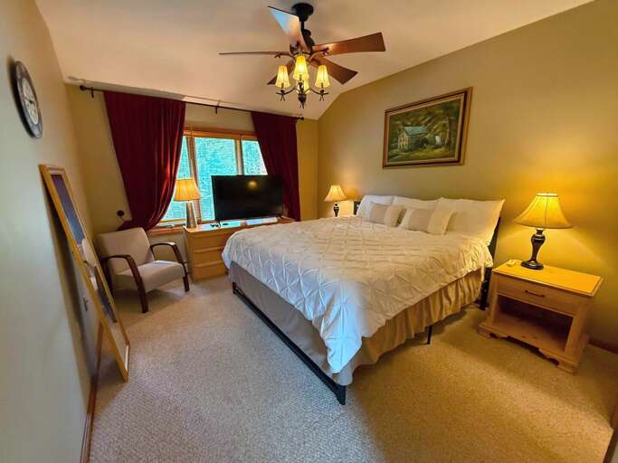 Upper-level Bedroom with a King bed and bathroom with a shower/tub combo Upper-level Bedroom with a King bed and bathroom with a shower/tub combo