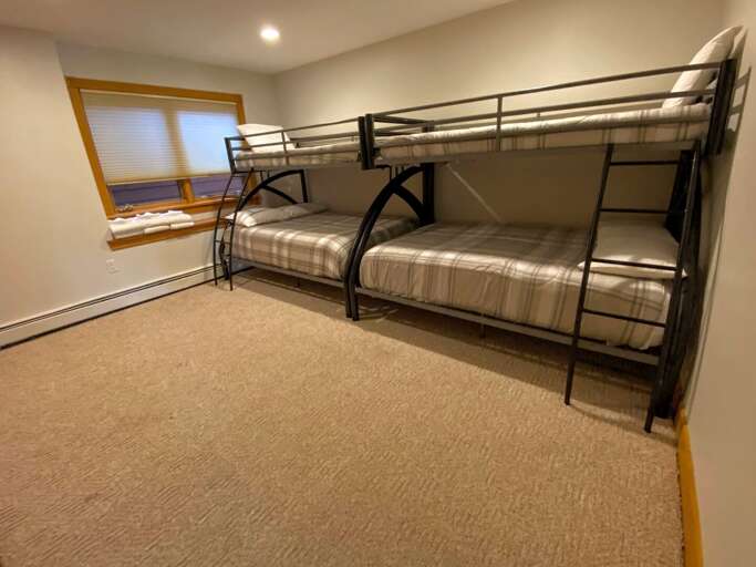 Lower level bunk bedroom with shared bath