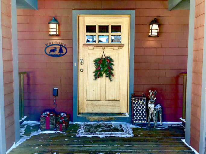 Residential Entrance With Christmas Wreath And Decorations