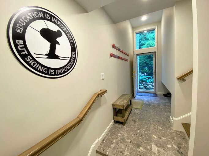 Entryway with bench and low storage area - between lower and 1st levels.