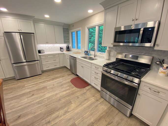 Renovated kitchen with new appliances.