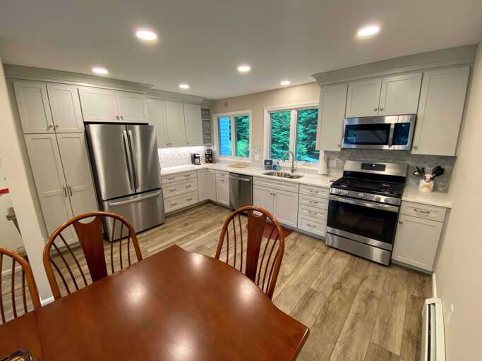Renovated kitchen with new appliances.
