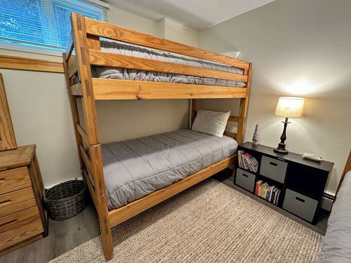 Lower level bunk room with two twin/twin bunk beds