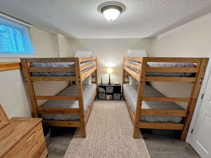 Lower level bunk room with two twin/twin bunk beds