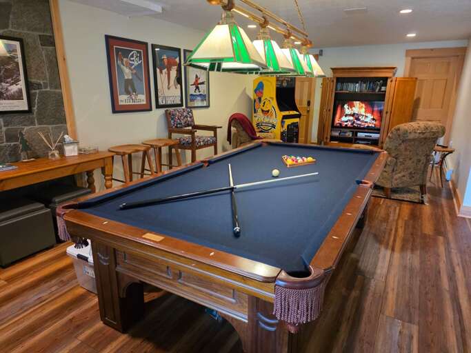 The lower level adds even more entertainment space, including a pool table