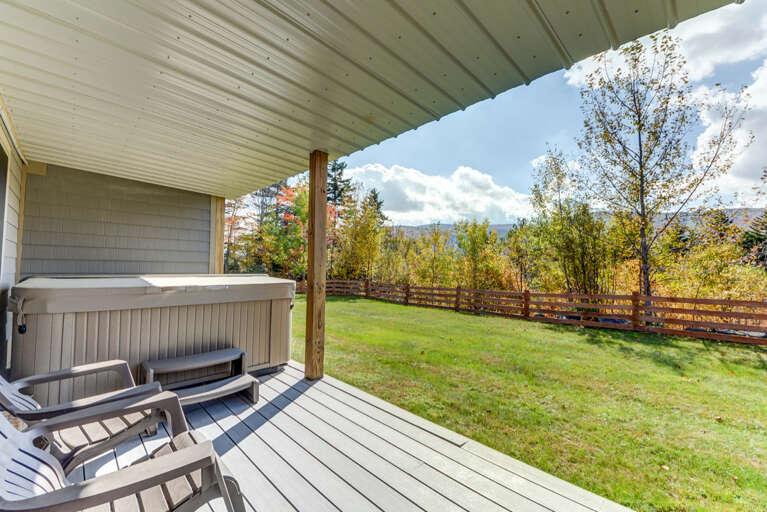 Access to the flat back yard from lower level and views of the Bretton Woods ski slopes from the hot tub! Access to the flat back yard from lower level and views of the Bretton Woods ski slopes from the hot tub!