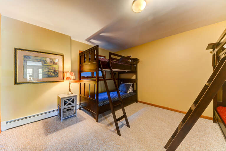 Located on the lower level and features 2 Twin over Twin bunk beds. Sleeps 4. Located on the lower level and features 2 Twin over Twin bunk beds. Sleeps 4.
