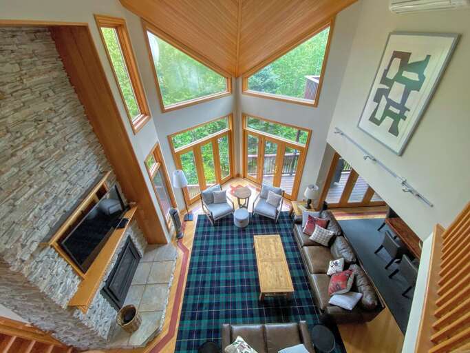 Living room with walkout upper deck and open concept Dining and Kitchen areas