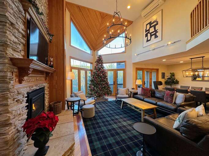 Living room with walkout upper deck and open concept Dining and Kitchen areas