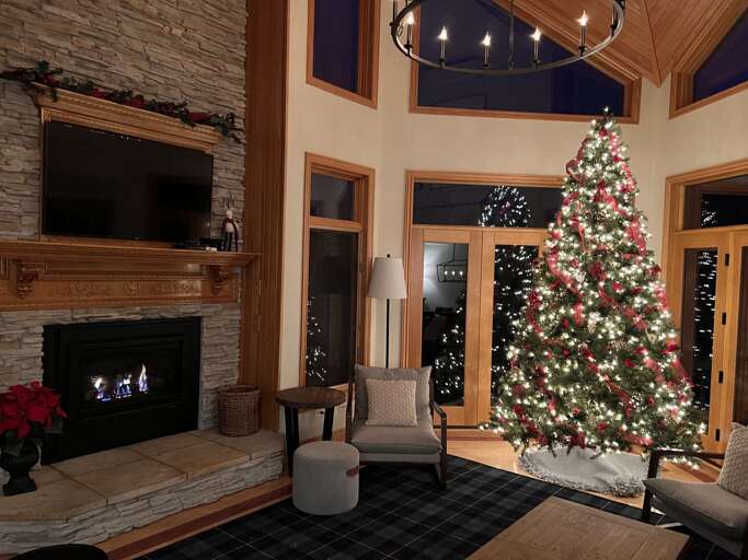 Living room with walkout upper deck and open concept Dining and Kitchen areas