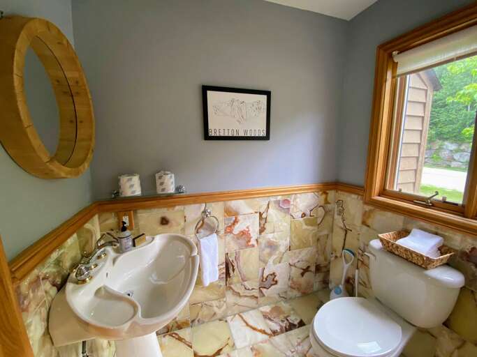 Main level half bath adjacent to dining room