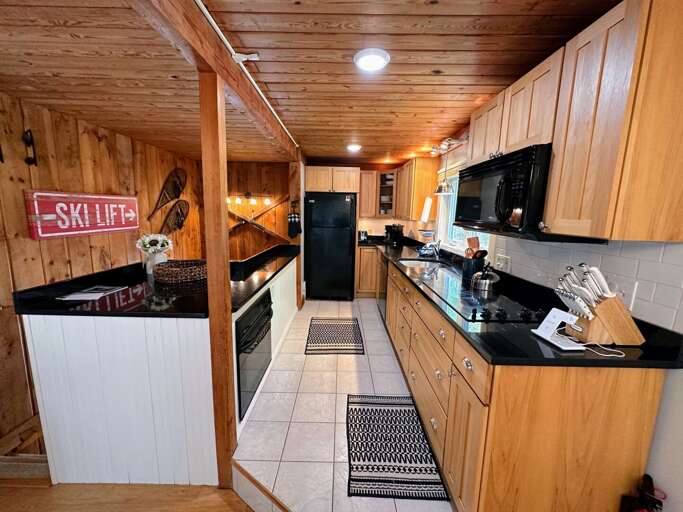 Well stocked kitchen with granite counter tops