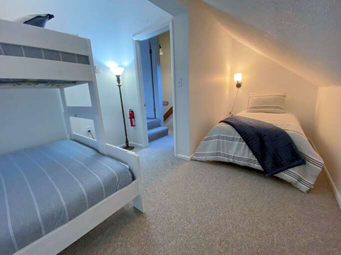 Upper Level bunk room with Twin/Queen bunk and Twin bed