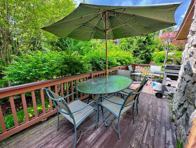 Deck has a dining table and propane grill Deck has a dining table and propane grill