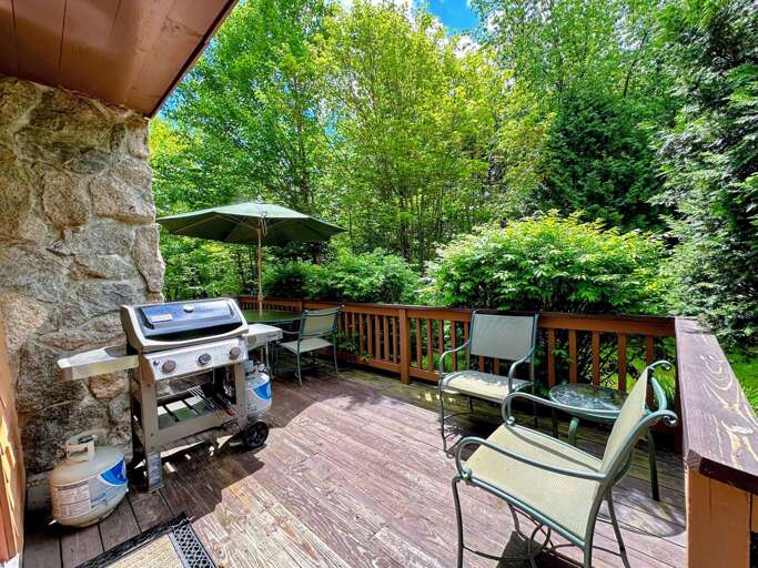 Deck has a dining table and propane grill Deck has a dining table and propane grill