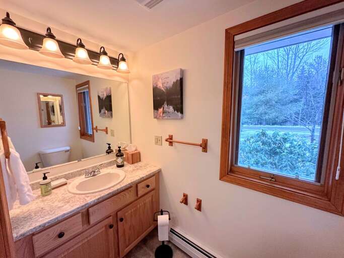 Full bath that features a jetted tub/shower combo.