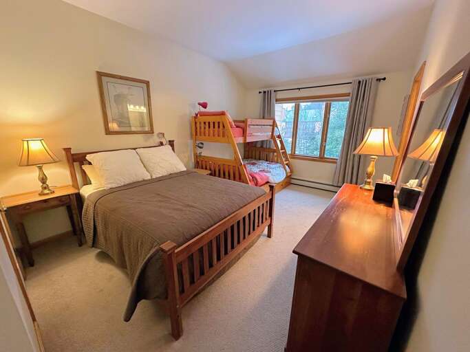 Queen/bunk room located in the upper level.