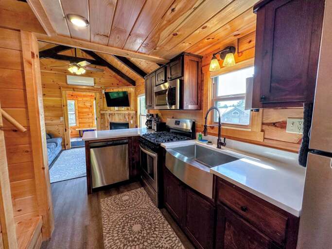 Kitchen with full size oven, dishwasher and microwave as well as a stackable Washer and Dryer Kitchen with full size oven, dishwasher and microwave as well as a stackable Washer and Dryer