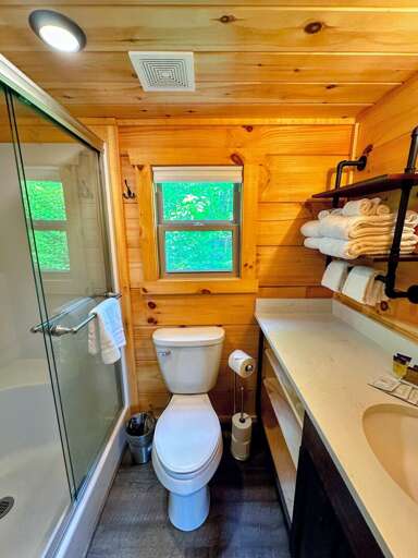 The bathroom is equipped with a shower.