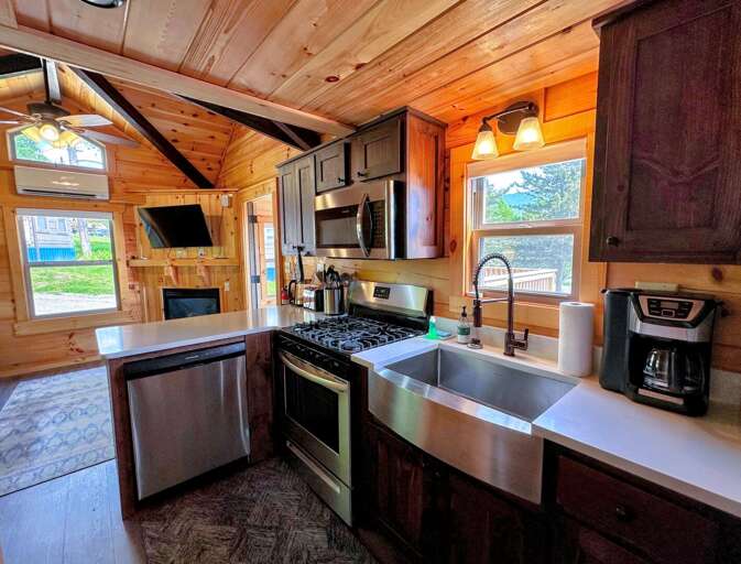 The kitchen has a dishwasher, microwave, oven and refrigerator as well as a stackable washer/dryer.