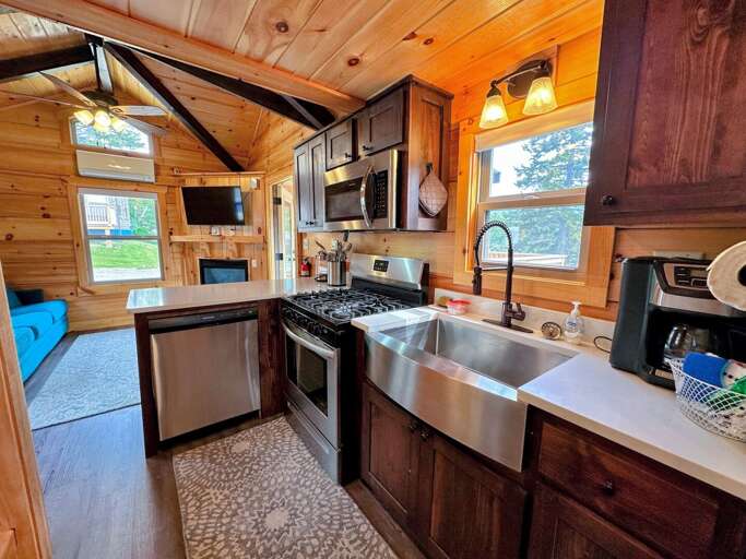 The kitchen has a dishwasher, microwave, oven and refrigerator as well as a stackable washer/dryer. The kitchen has a dishwasher, microwave, oven and refrigerator as well as a stackable washer/dryer.