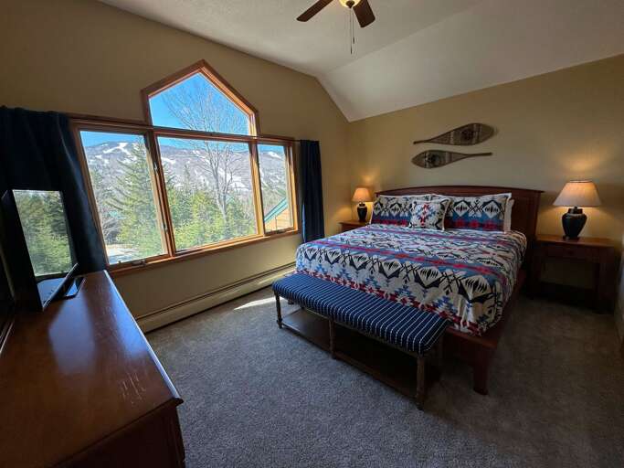 Upstairs King bedroom with private bath, TV and mountain views