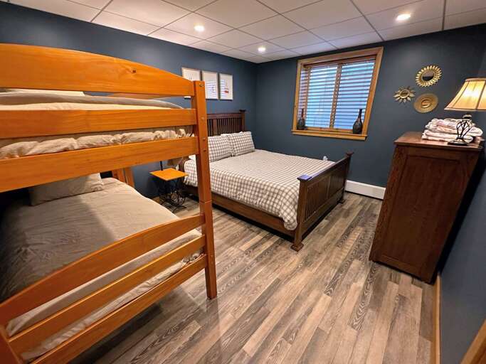 Lower level bedroom with Queen bed and twin/twin bunk