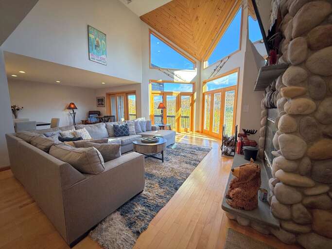 Main Living Room with Wood Fireplace and TV