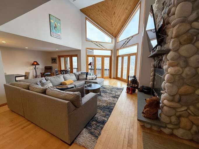 Main Living Room with Wood Fireplace and TV