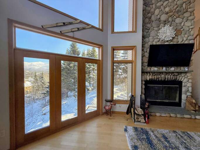 Main Living Room with Wood Fireplace and TV