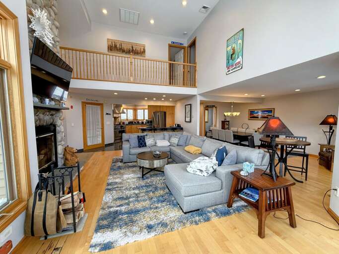 Main Living Room with Wood Fireplace and TV