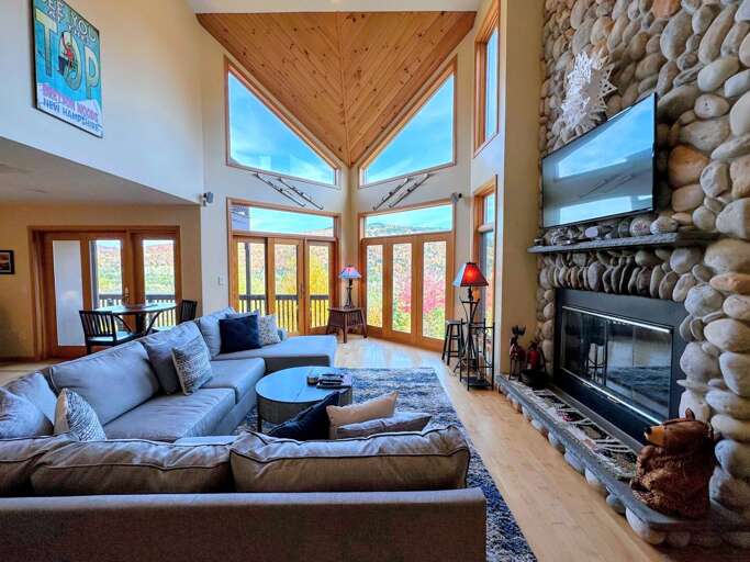 Main Living Room with Wood Fireplace and TV (fall)