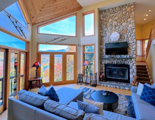 Main Living Room with Wood Fireplace and TV (fall)