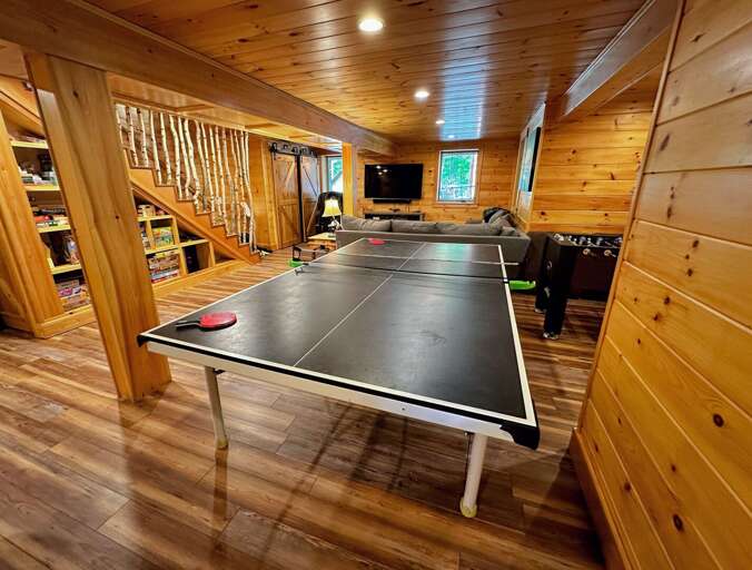 Lower level with foosball, ping pong, and small air hockey