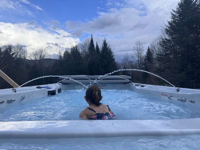 The swimspa features a hot tub section (3 seats) and a swim area, where a strong current enables a user to swim peacefully in the warm water, year around