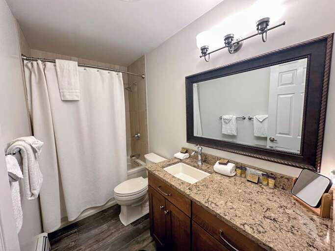 Shared full bath with shower/tub combo